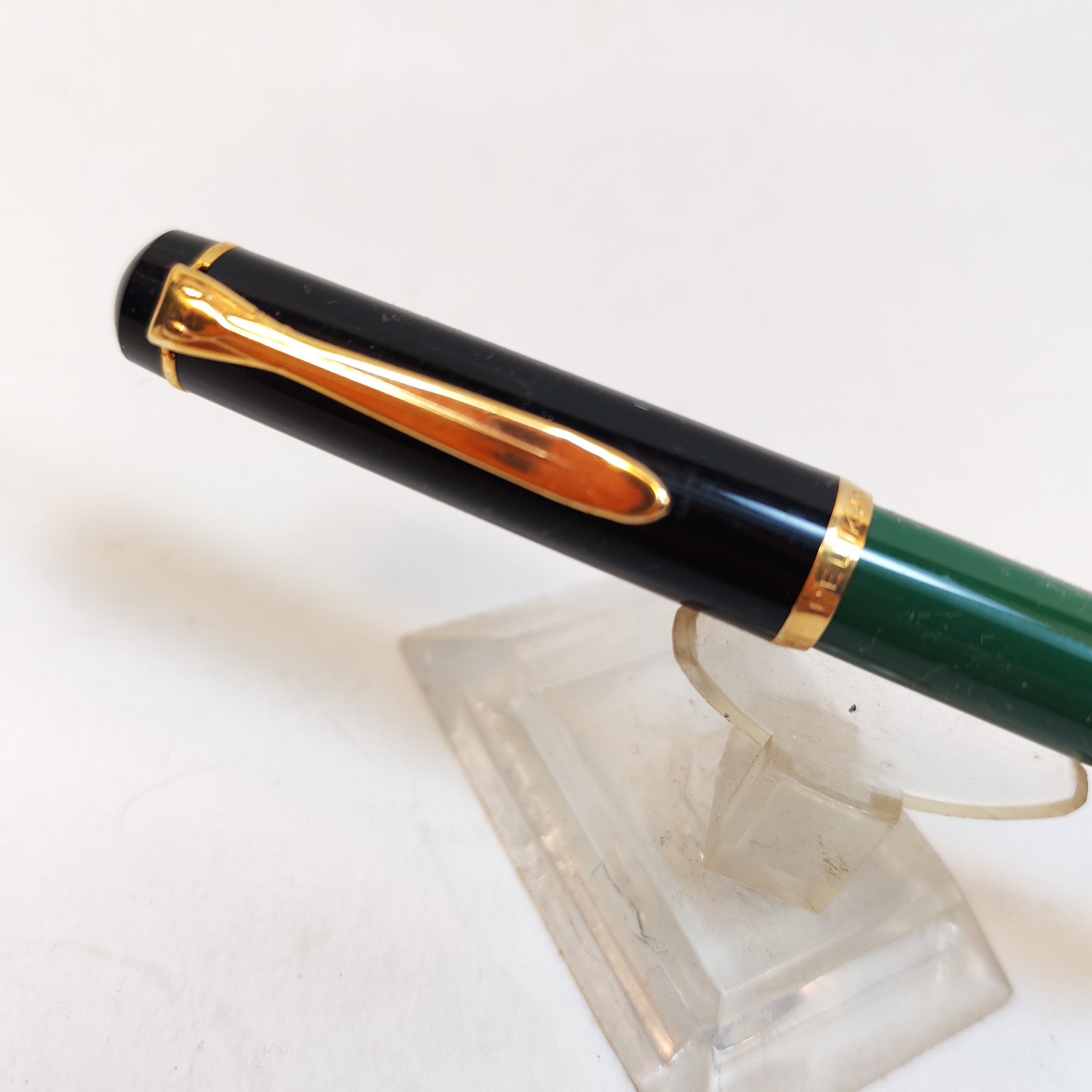 Vintage Pelikan m150 Fountain Pen Black with GT Made In Germany Piston fill detail photograph