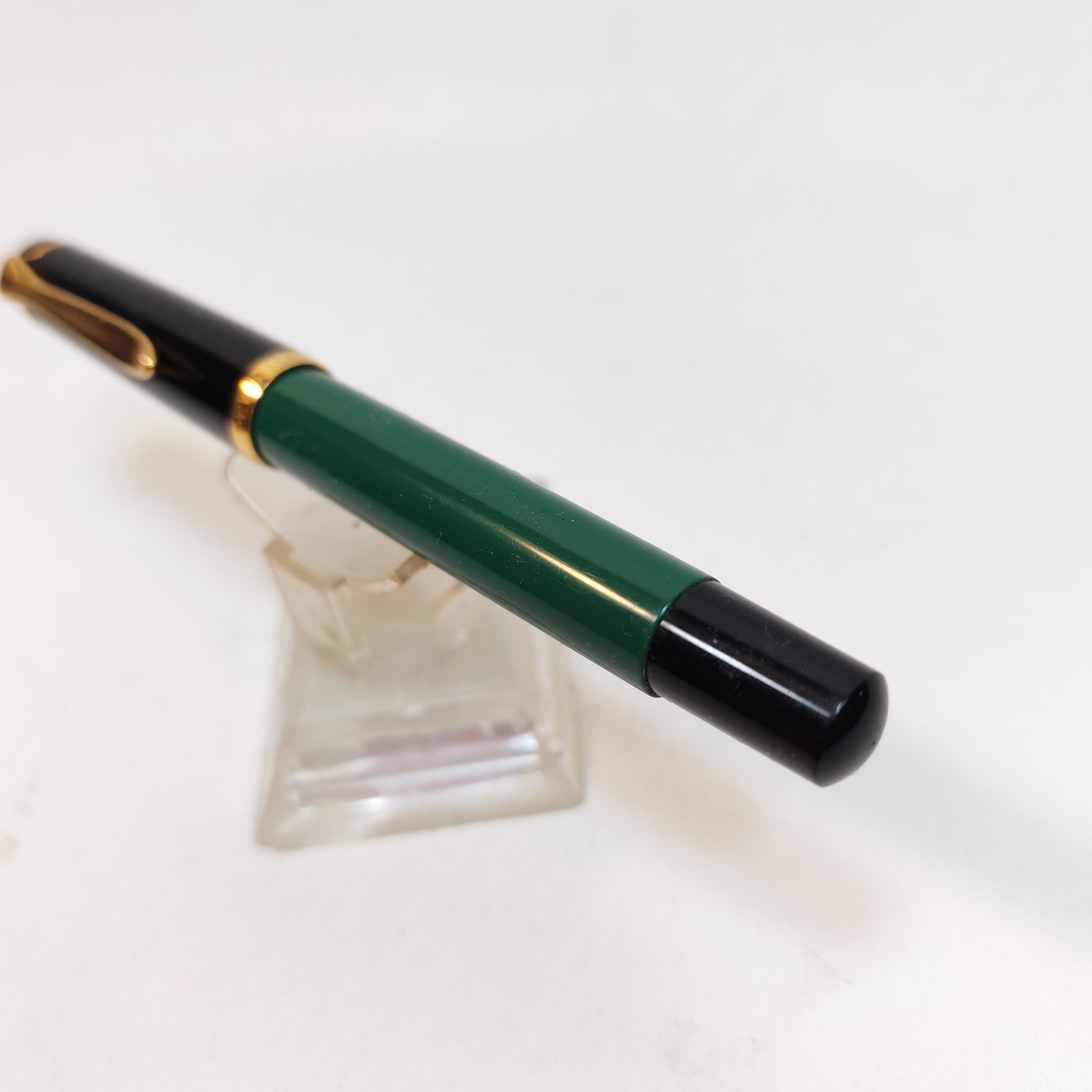 Vintage Pelikan m150 Fountain Pen Black with GT Made In Germany Piston fill detail photograph