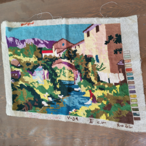 vintage village scene needlepoint canvas sold by Sweilems in Amman
