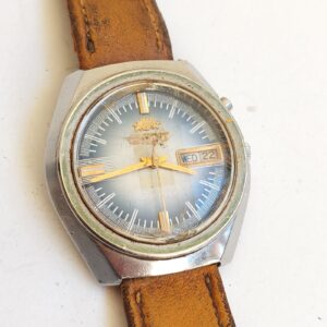 vintage Orient automatic wristwatch featuring a blue-toned dial  needs service