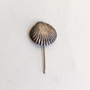 vintage silver-toned stick pin featuring a textured seashell sold by Sweilems in Amman