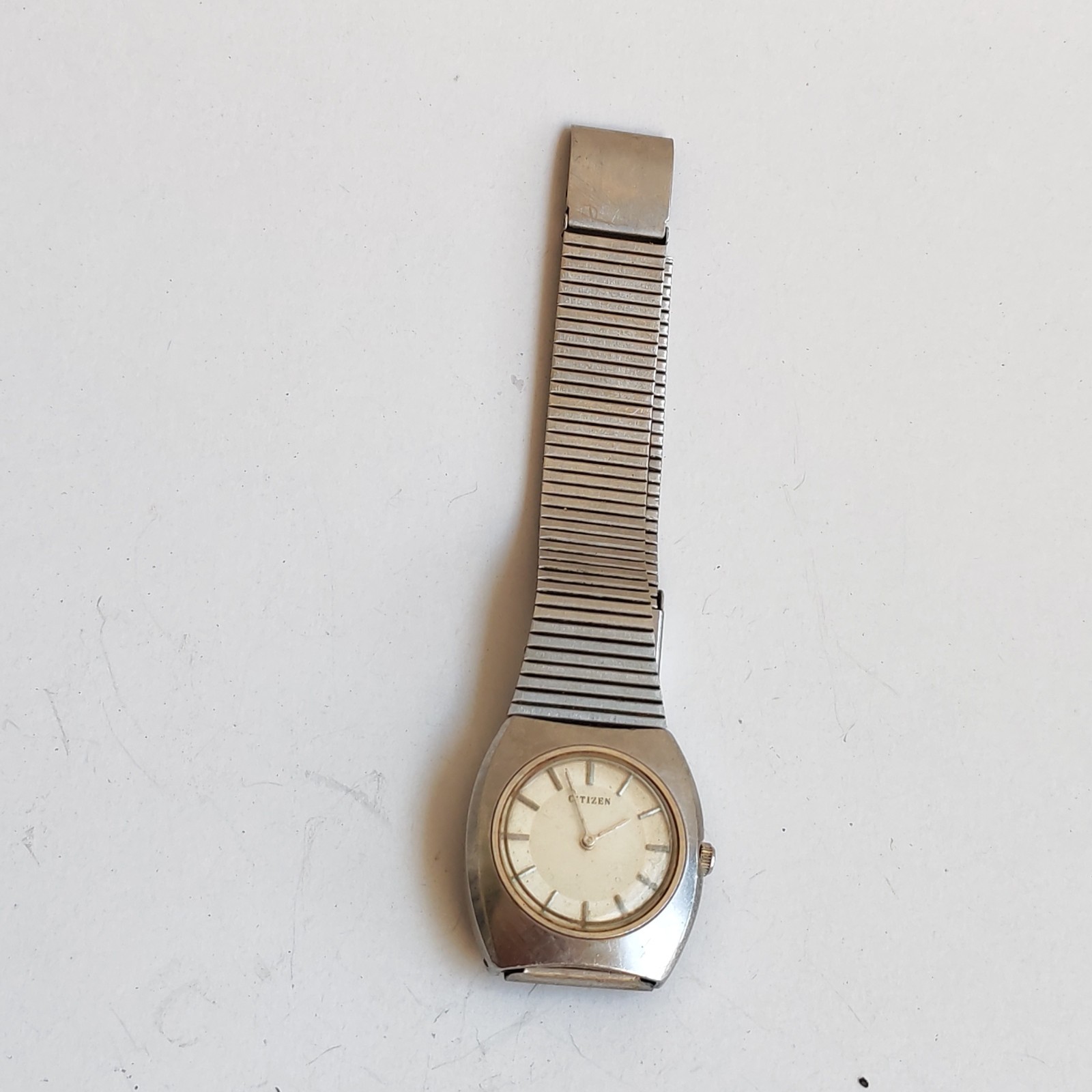 vintage Citizen stainless steel watch with a minimalist dial detail photograph