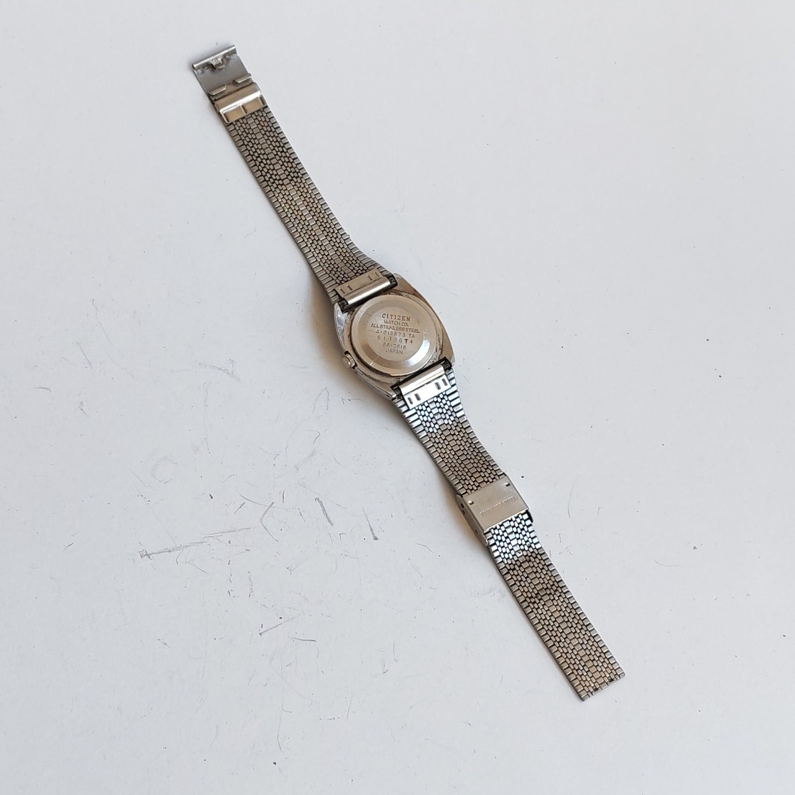 vintage Citizen stainless steel watch with a minimalist dial detail photograph