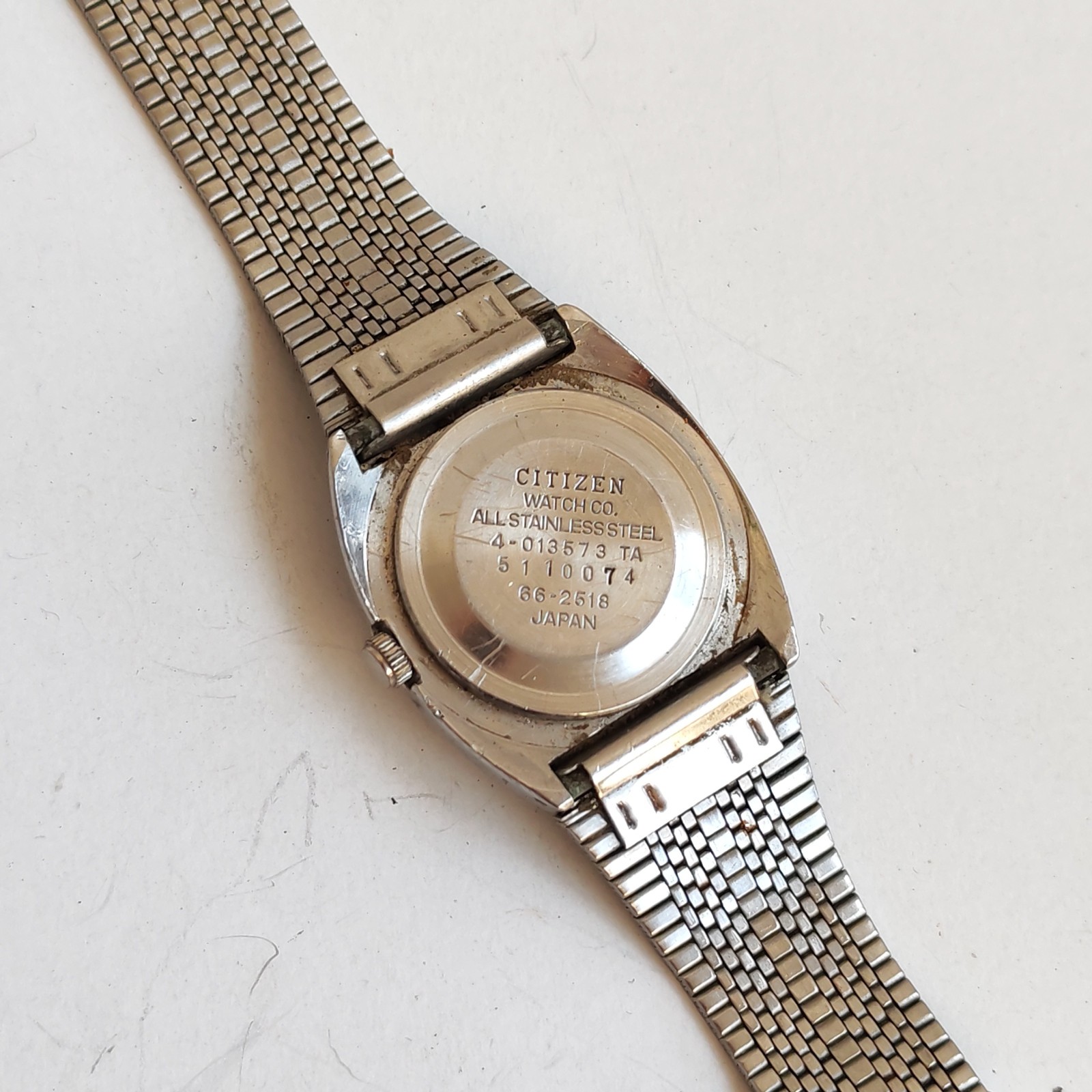vintage Citizen stainless steel watch with a minimalist dial detail photograph
