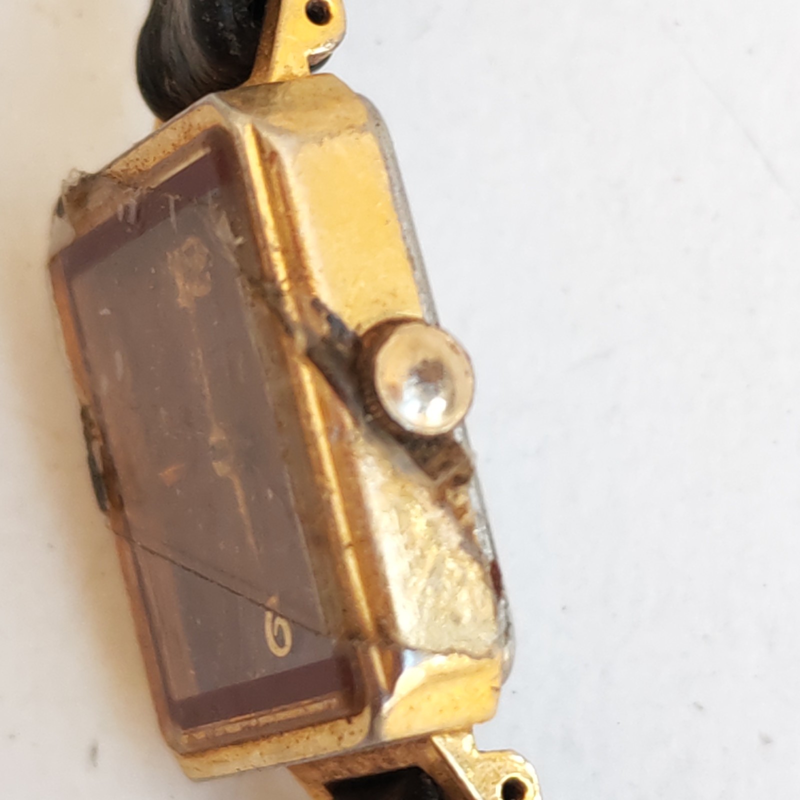 vintage gold-tone Orient Quartz rectangular watch detail photograph