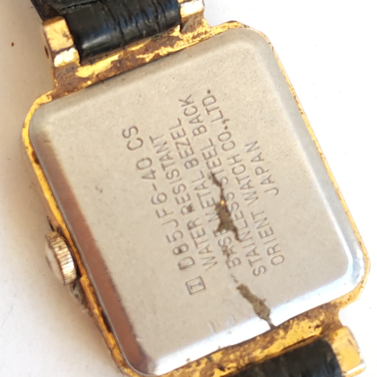 vintage gold-tone Orient Quartz rectangular watch detail photograph