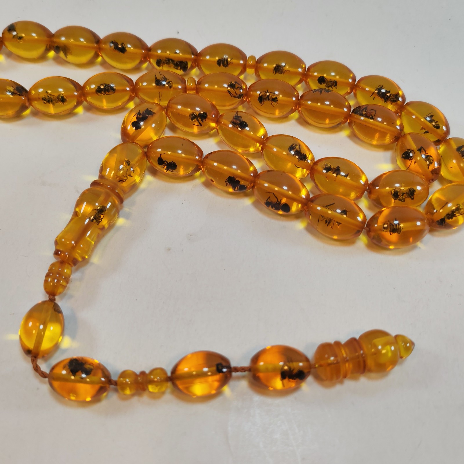 33 Beads Pressed Amber Tasbih Insect Inclusion Prayer Beads 19 13mm detail photograph