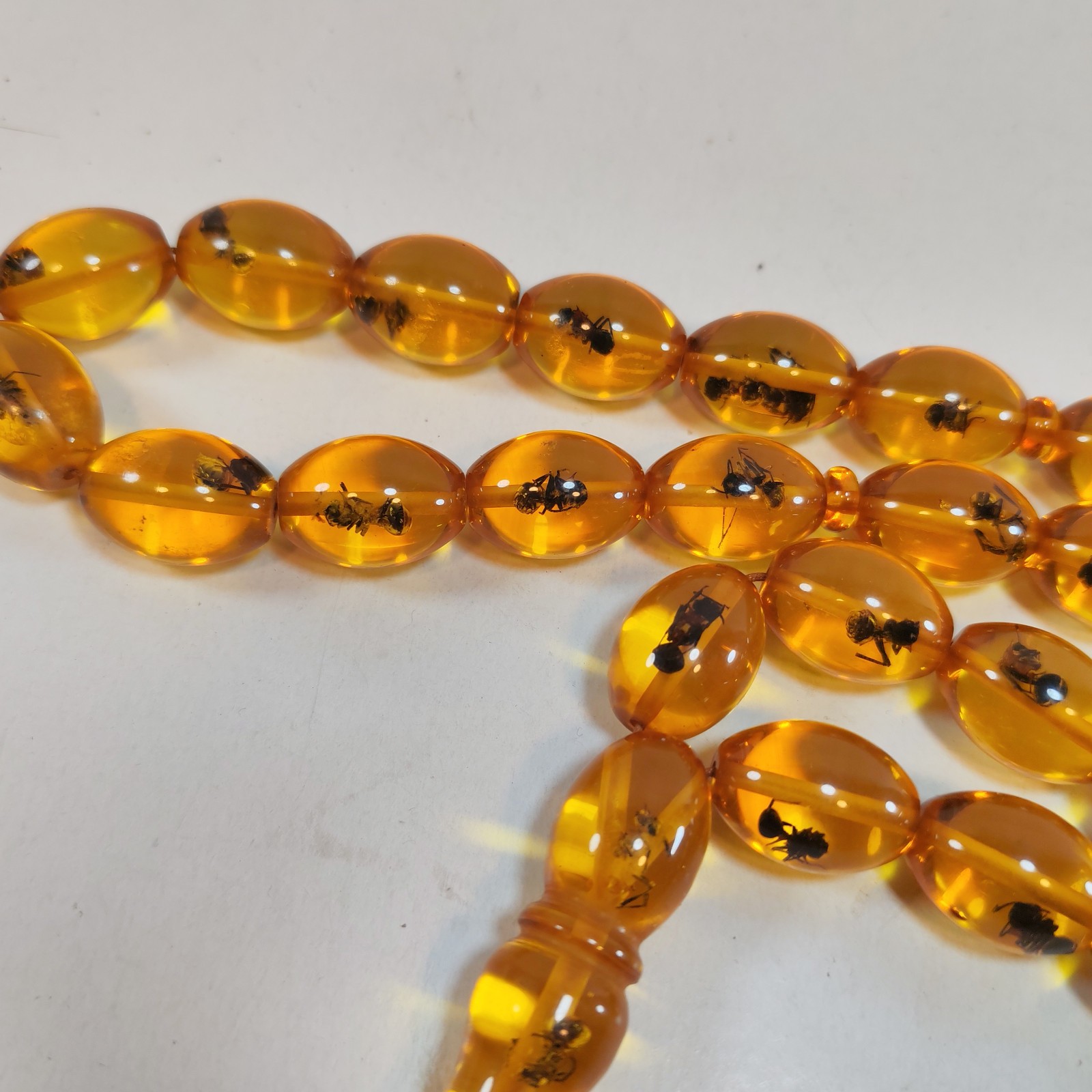 33 Beads Pressed Amber Tasbih Insect Inclusion Prayer Beads 19 13mm detail photograph
