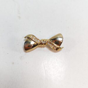 Vintage gold toned bow brooch with clear rhinestones 1 5 sold by Sweilems in Amman