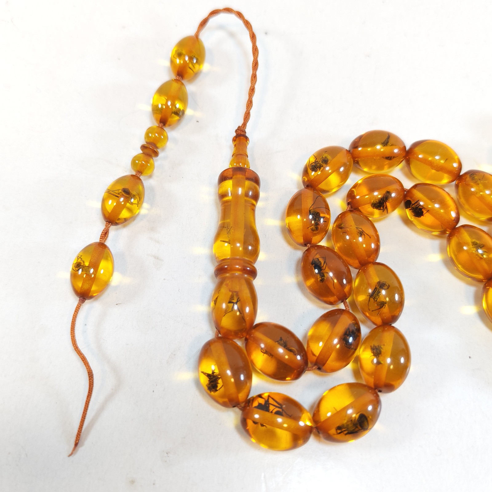 33 Beads Pressed Amber Tasbih Insect Inclusion Prayer Beads Misbaha 15 11mm detail photograph