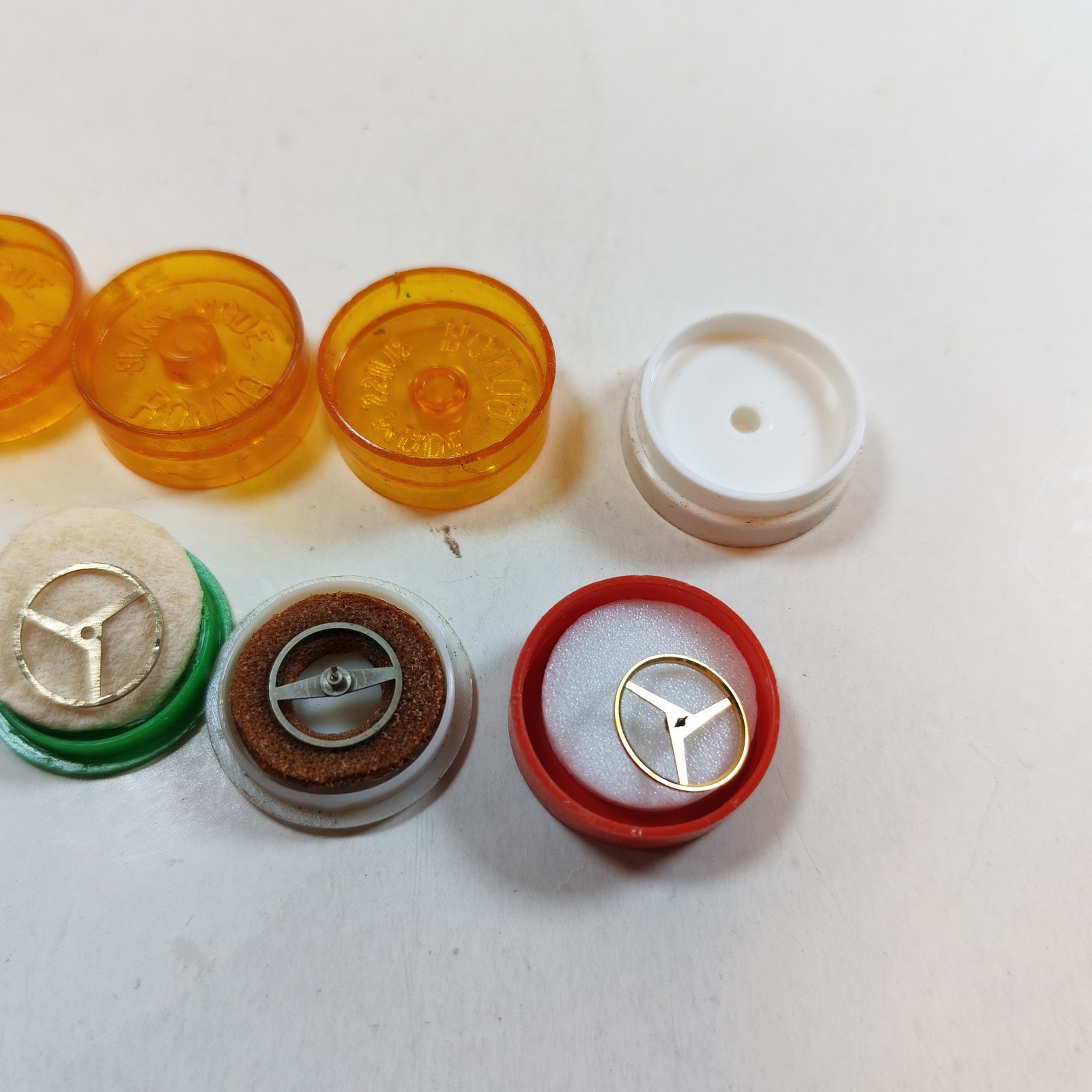 Vintage Small Watch Parts Storage Tin Lot and some watch parts lot detail photograph