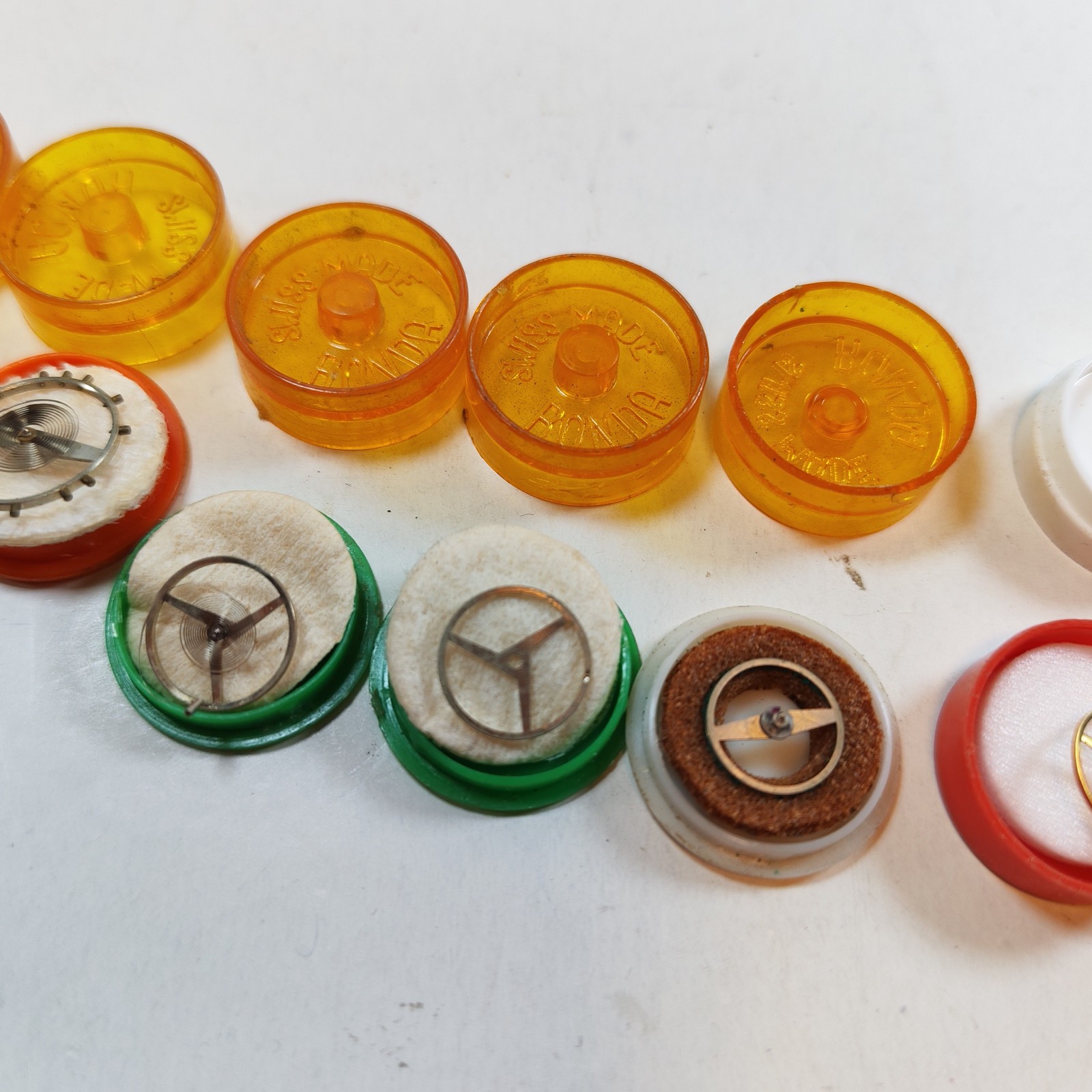 Vintage Small Watch Parts Storage Tin Lot and some watch parts lot detail photograph