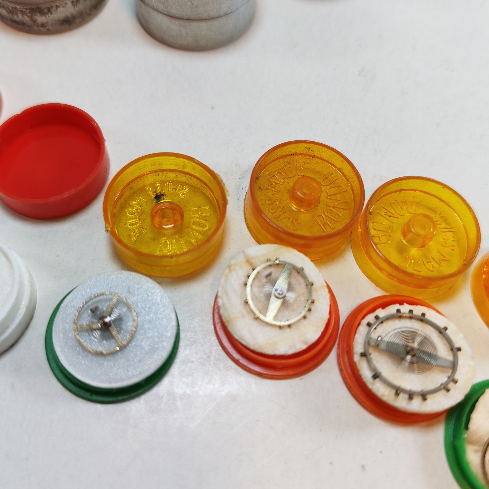 Vintage Small Watch Parts Storage Tin Lot and some watch parts lot detail photograph