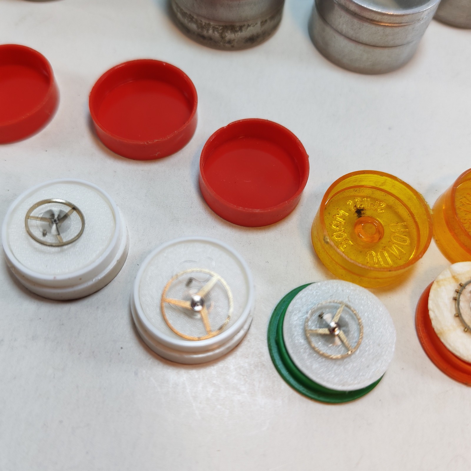 Vintage Small Watch Parts Storage Tin Lot and some watch parts lot detail photograph