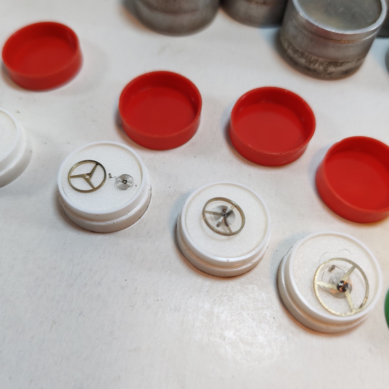 Vintage Small Watch Parts Storage Tin Lot and some watch parts lot detail photograph