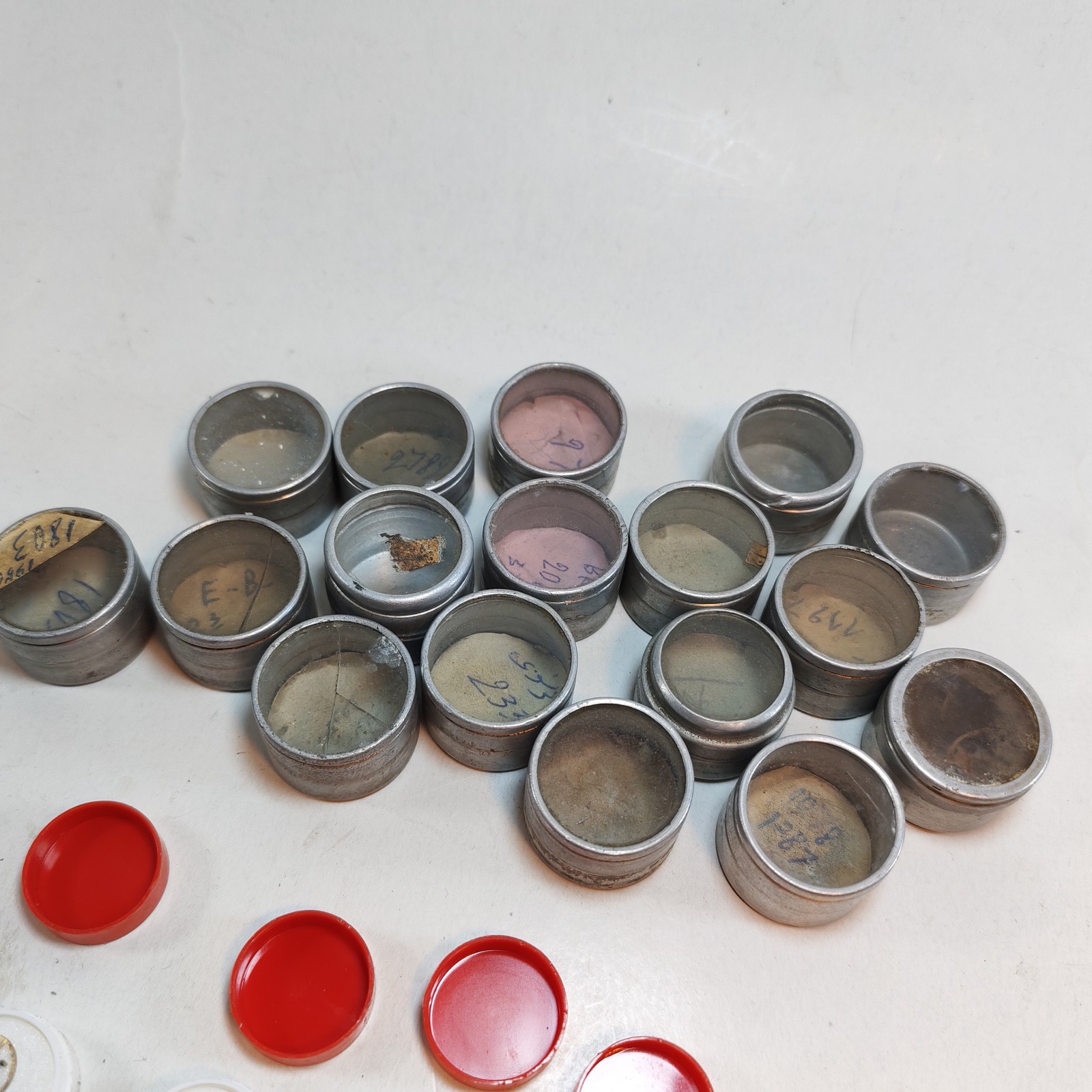 Vintage Small Watch Parts Storage Tin Lot and some watch parts lot detail photograph