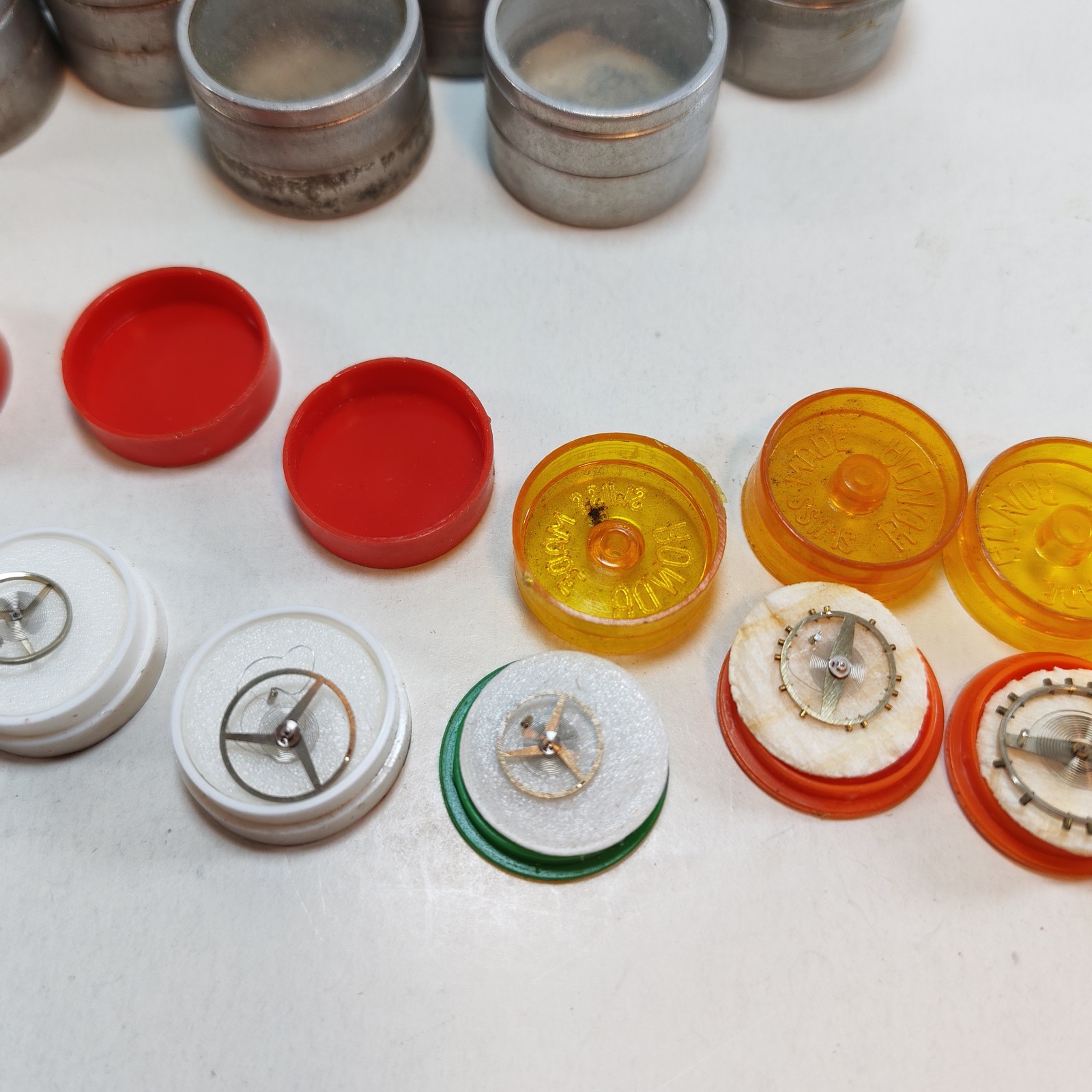 Vintage Small Watch Parts Storage Tin Lot and some watch parts lot detail photograph
