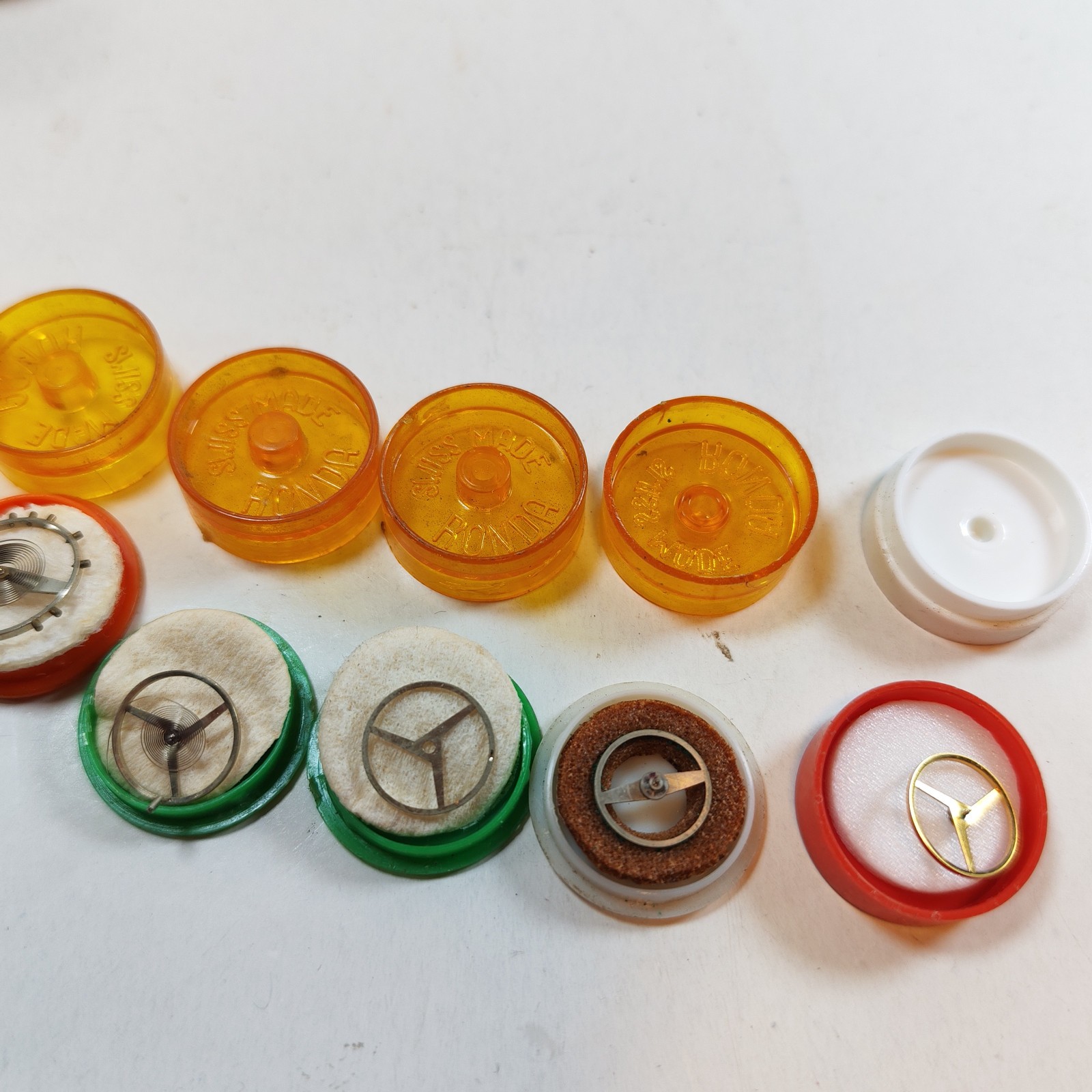 Vintage Small Watch Parts Storage Tin Lot and some watch parts lot detail photograph