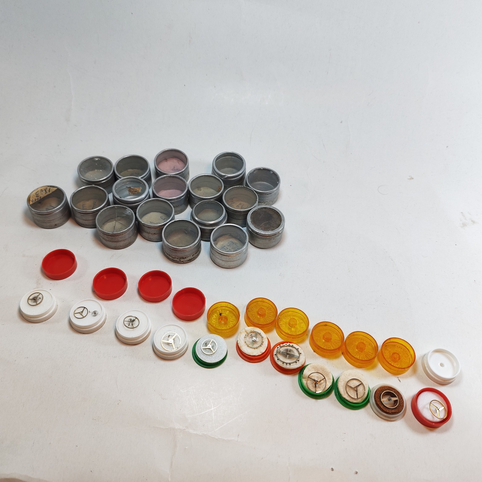 Vintage Small Watch Parts Storage Tin Lot and some watch parts lot detail photograph