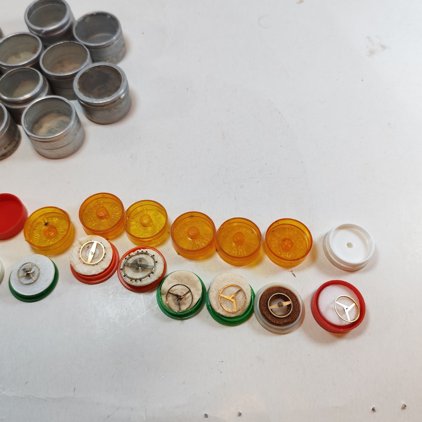 Vintage Small Watch Parts Storage Tin Lot and some watch parts lot detail photograph