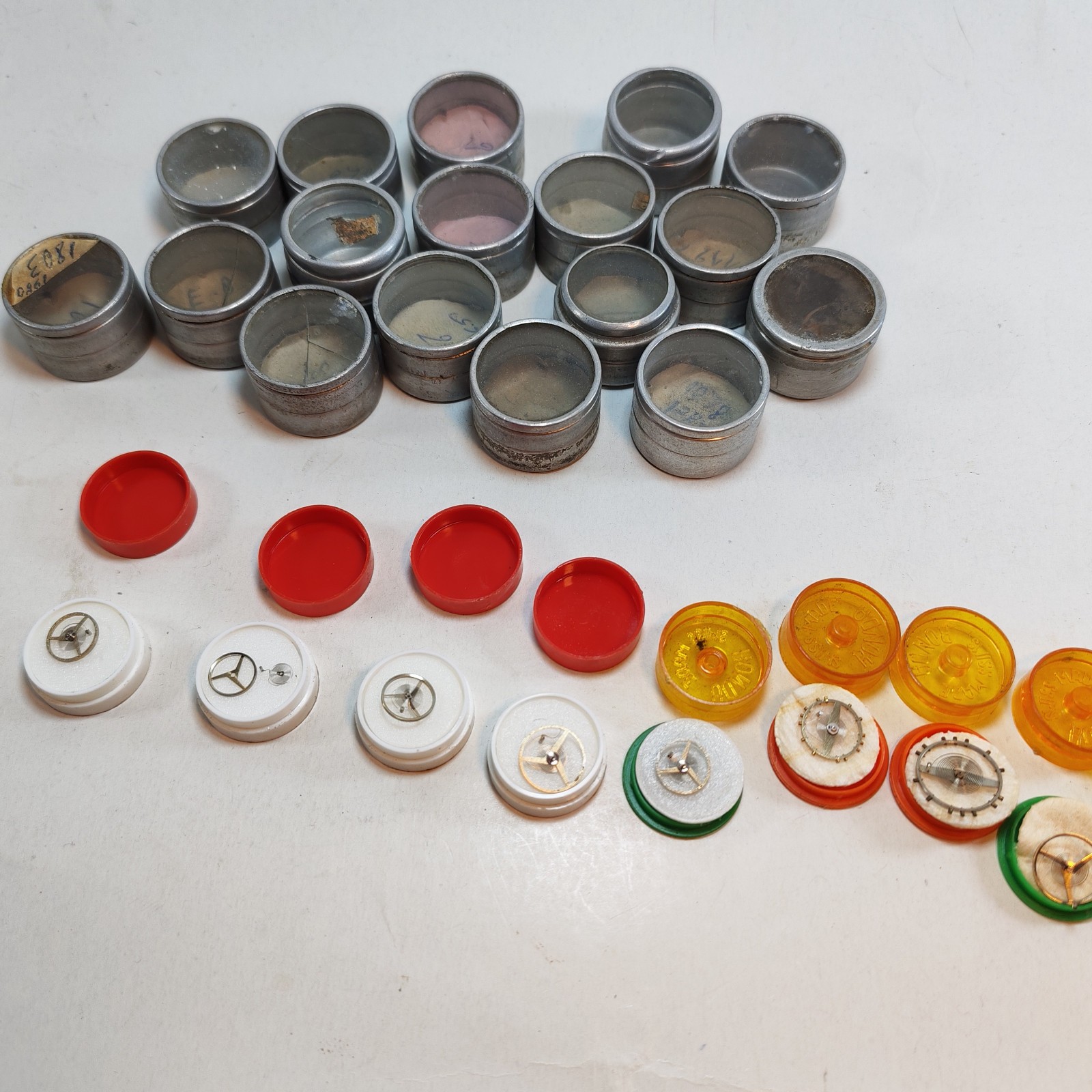 Vintage Small Watch Parts Storage Tin Lot and some watch parts lot detail photograph