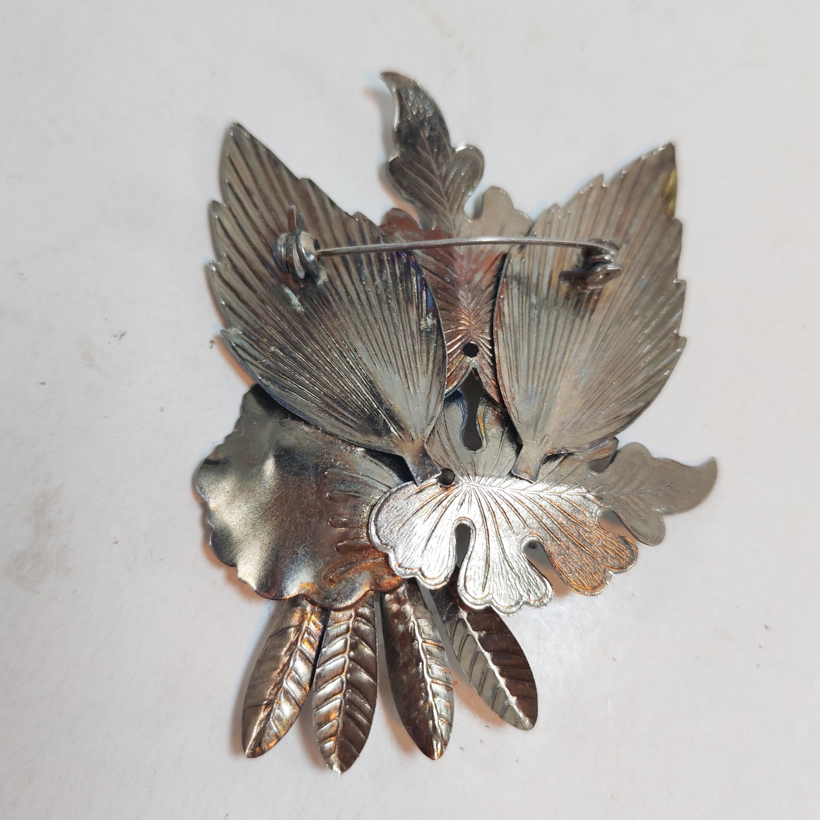 Vintage floral brooch 2 5 missing stone detail photograph