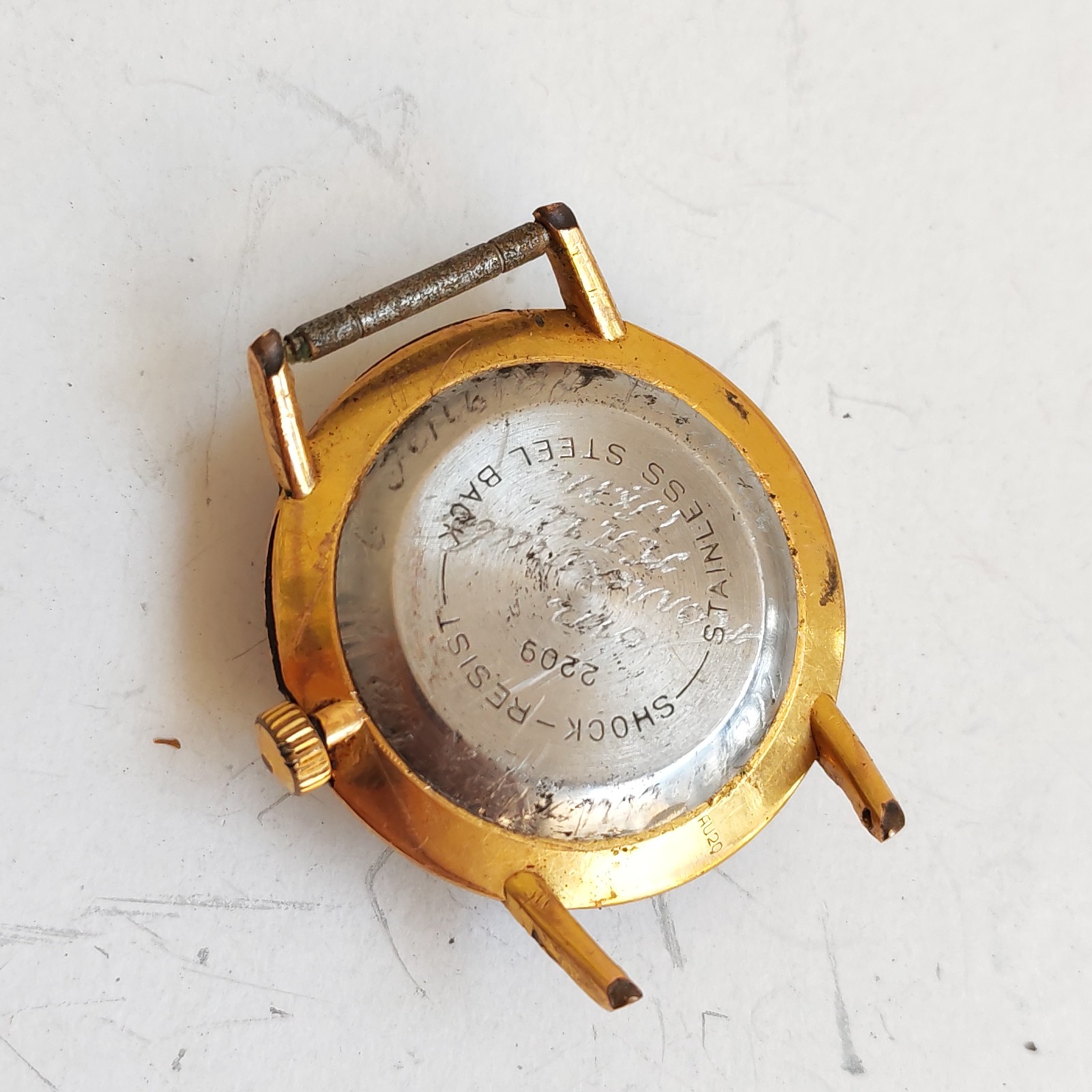 Vintage hand winding watch needs service detail photograph