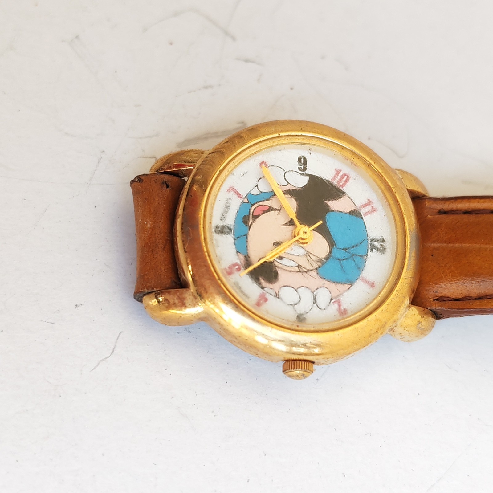 vintage Lorus Minnie Mouse watch with a gold-tone case detail photograph