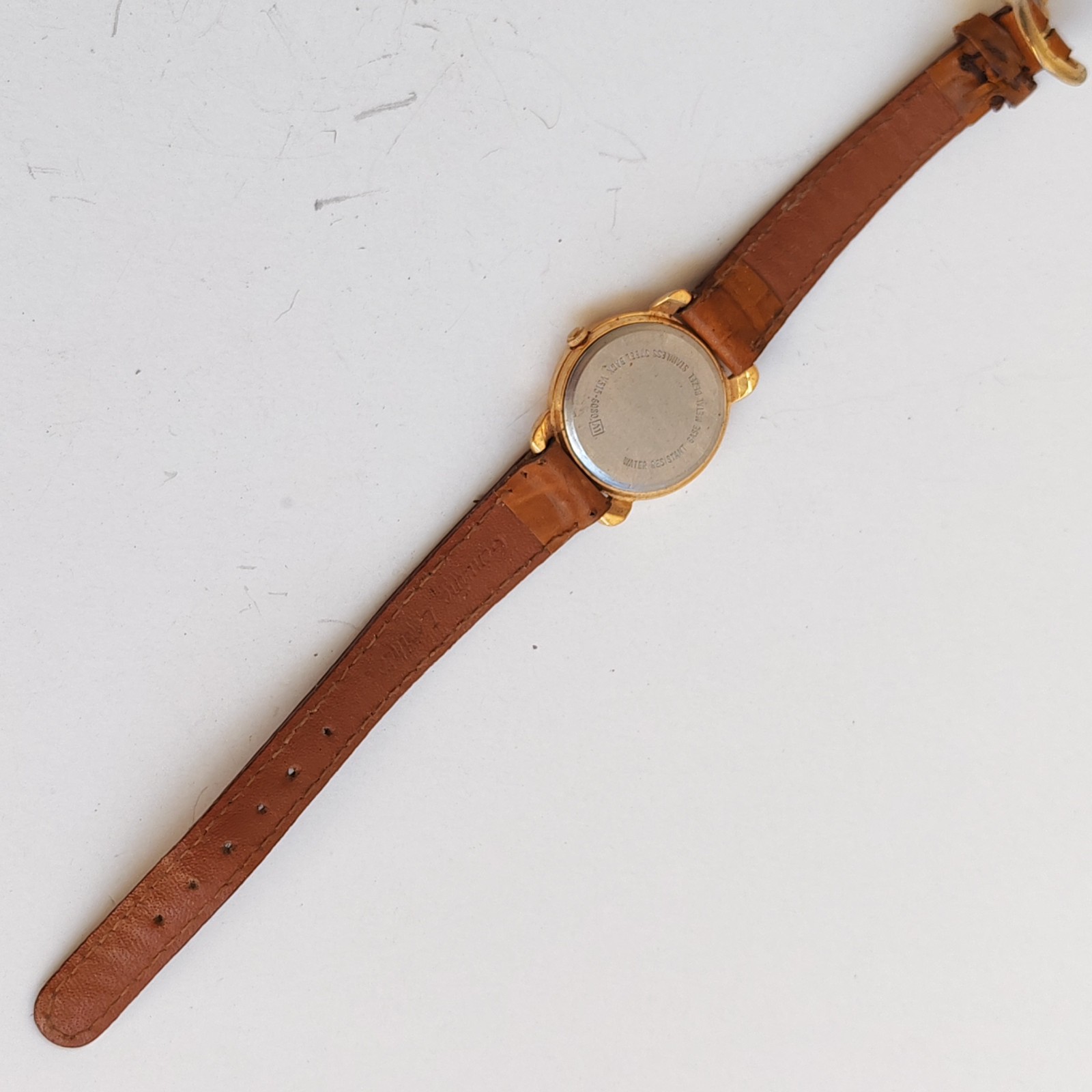 vintage Lorus Minnie Mouse watch with a gold-tone case detail photograph