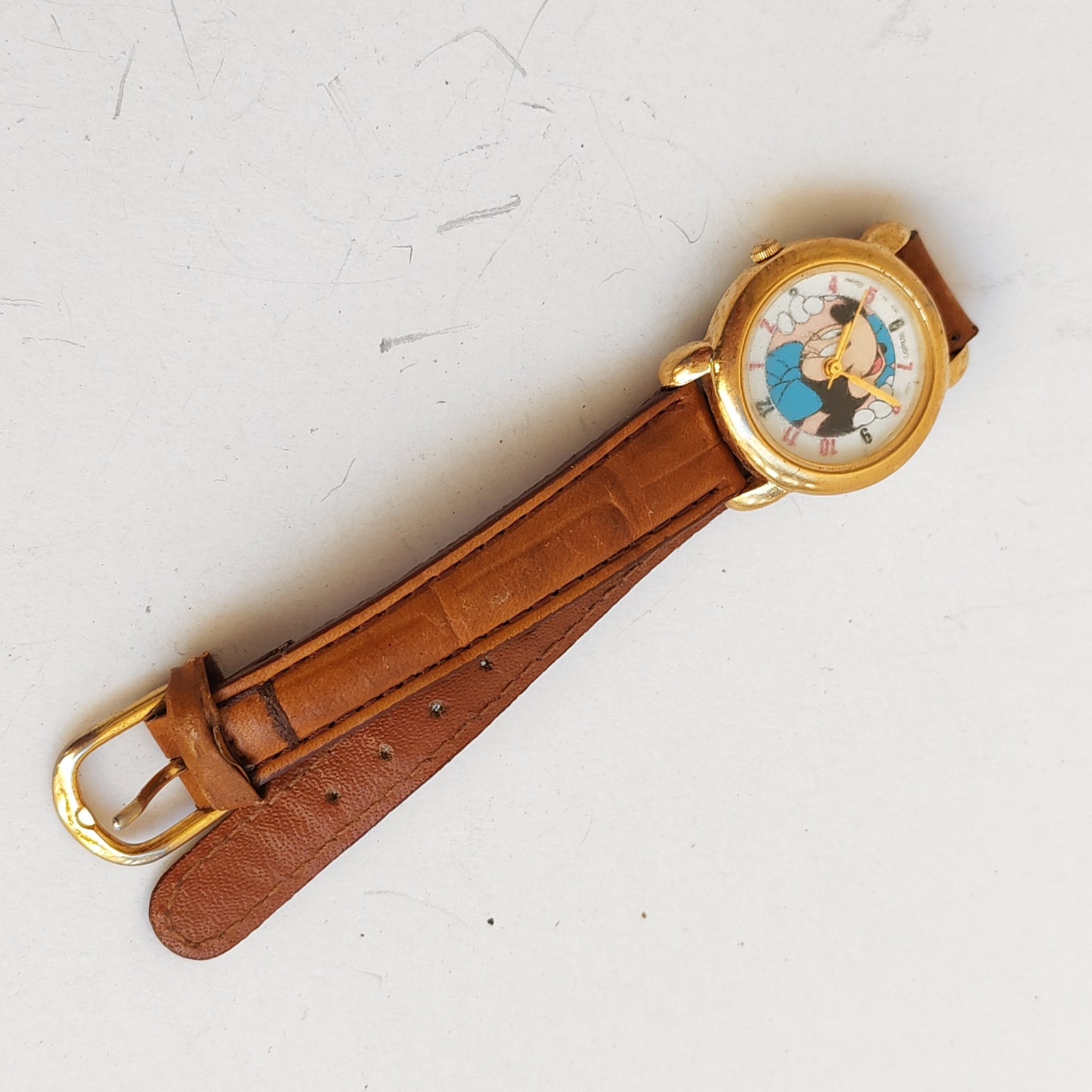 vintage Lorus Minnie Mouse watch with a gold-tone case detail photograph