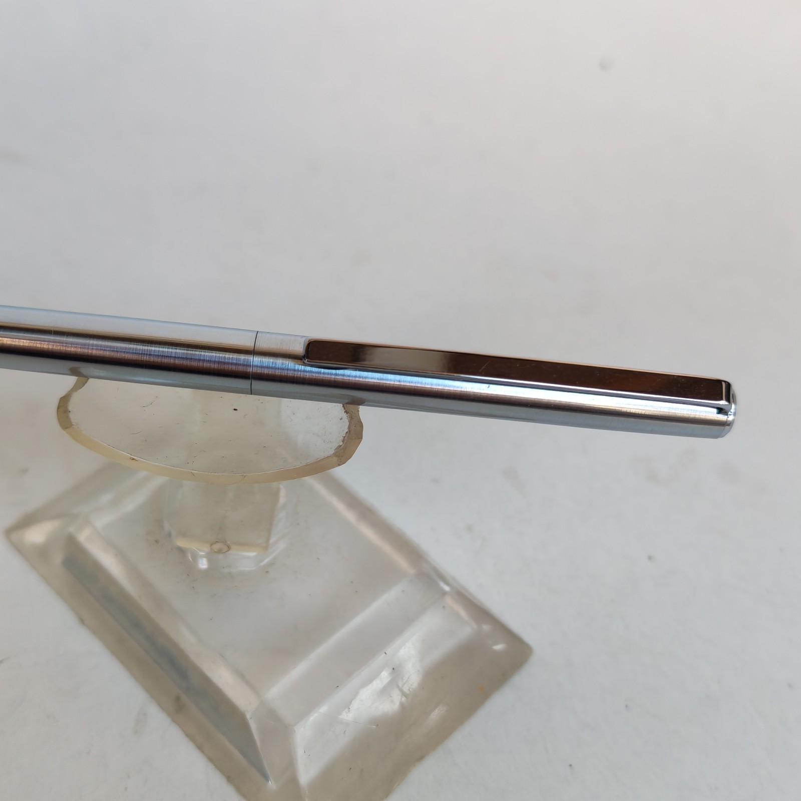 Vintage slim ballpoint pen with the letter B as logo detail photograph