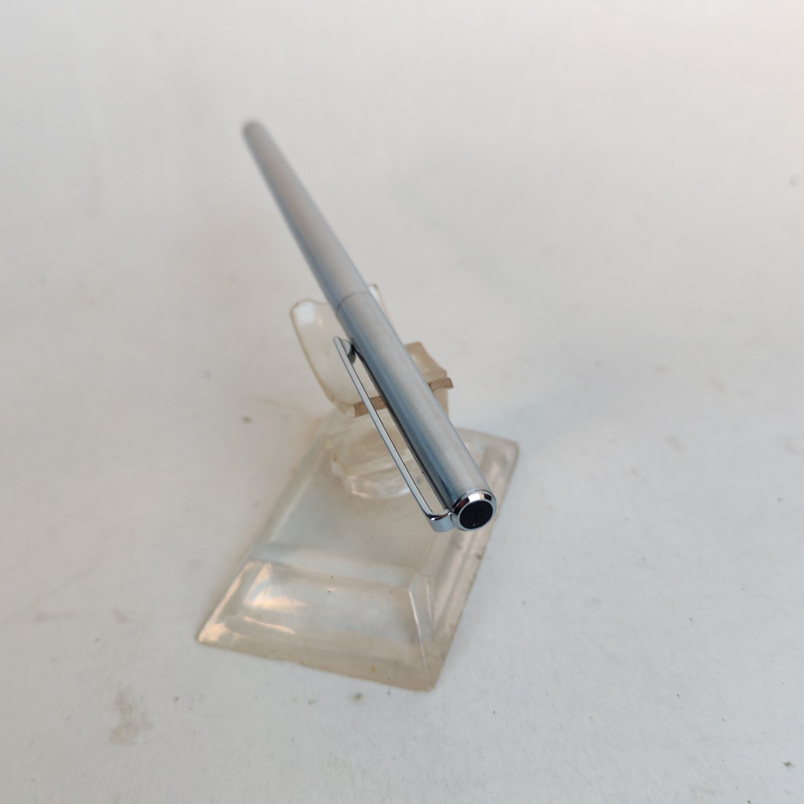 Vintage slim ballpoint pen with the letter B as logo detail photograph