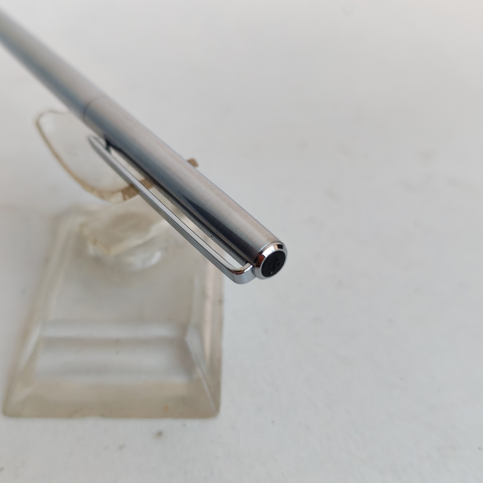 Vintage slim ballpoint pen with the letter B as logo detail photograph