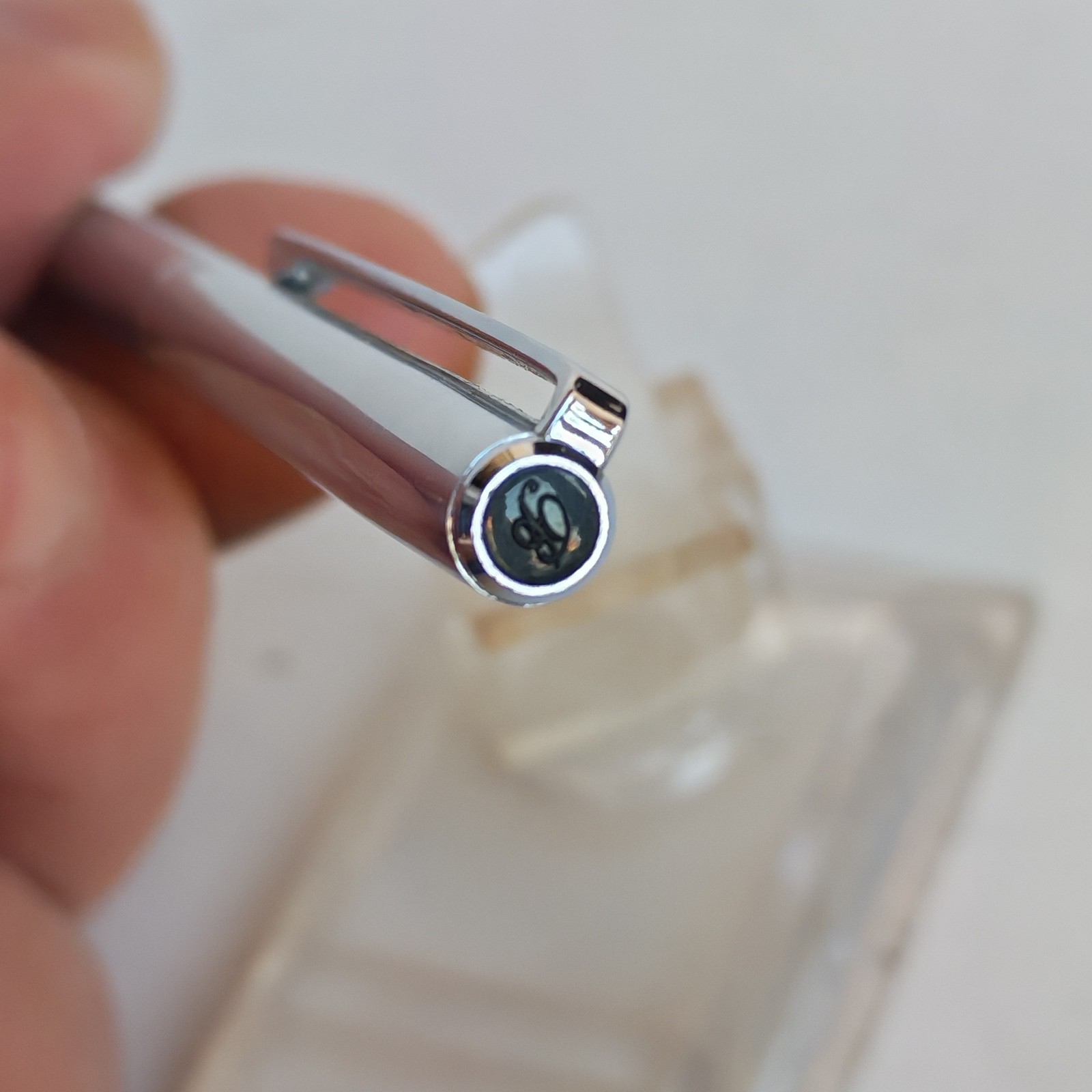 Vintage slim ballpoint pen with the letter B as logo detail photograph