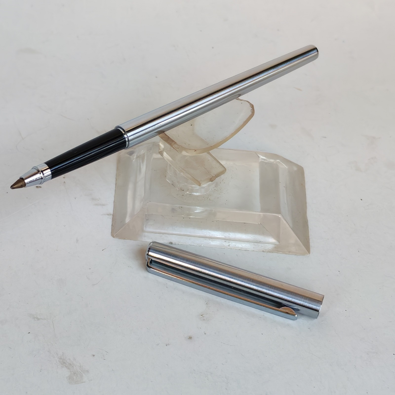 Vintage slim ballpoint pen with the letter B as logo detail photograph