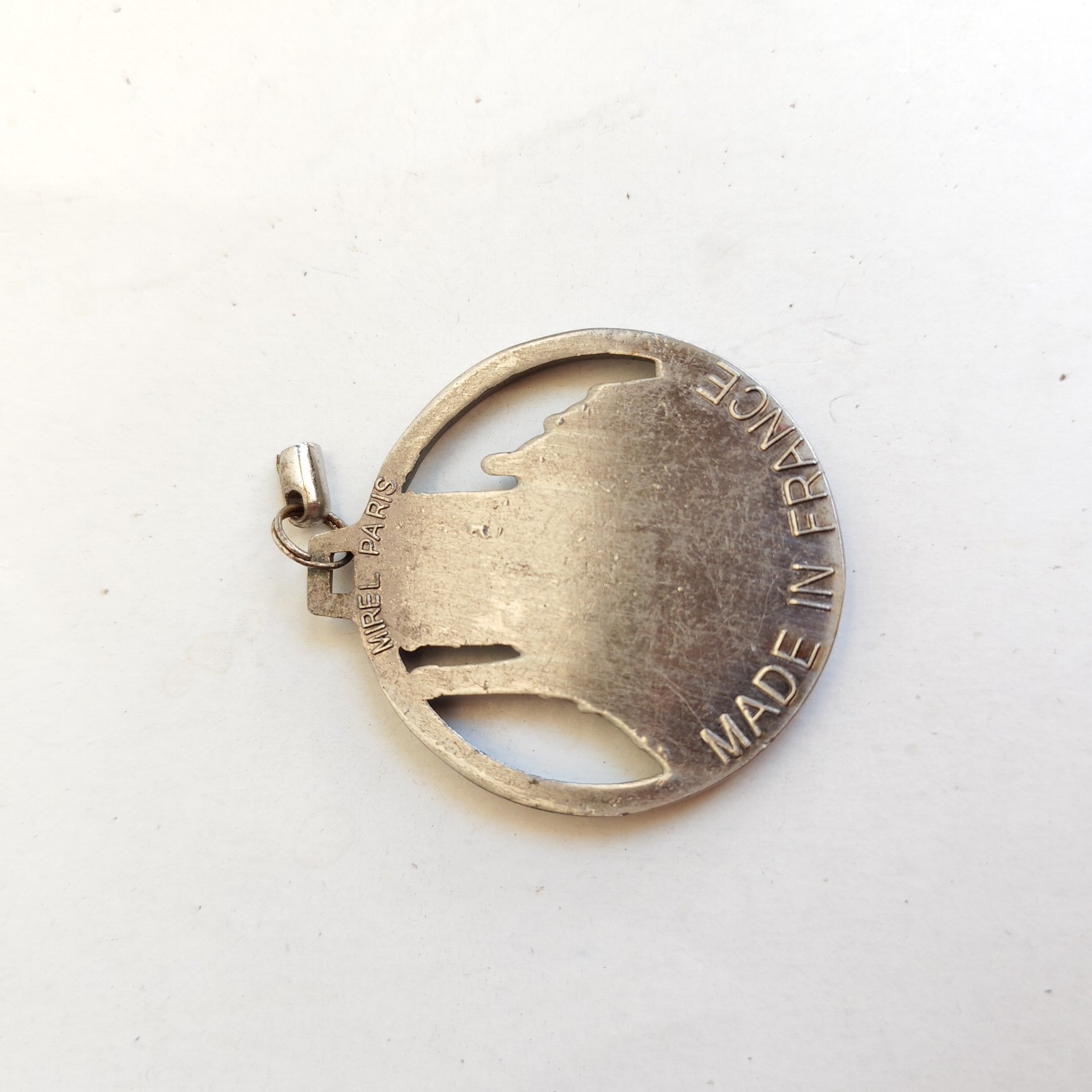 metal Paris souvenir pendant or keychain detail photograph