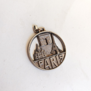 metal Paris souvenir pendant or keychain sold by Sweilems in Amman