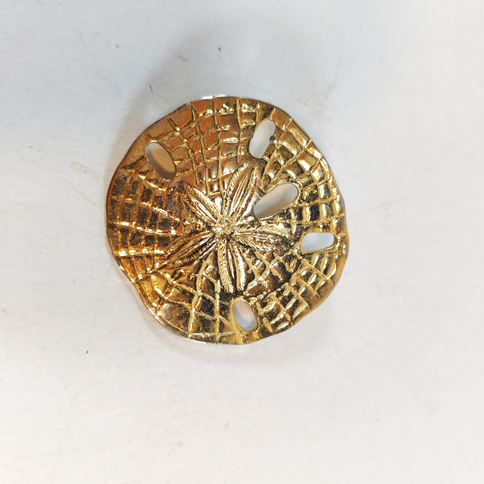 Vintage Sand Dollar Gold Tone brooch 1 5 sold by Sweilems in Amman